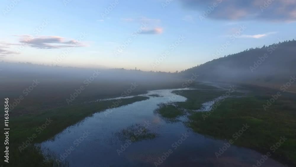 Aerial shot of a wetland in morning fog Aerial shot of a wetland in morning fog