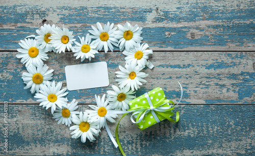 Daisy flowers on wooden background