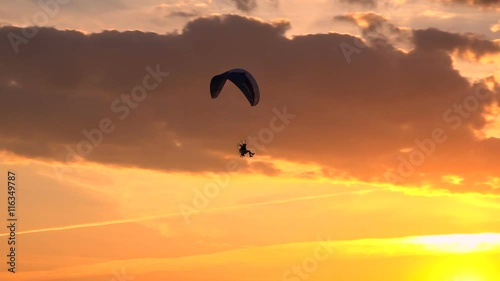 Paramotor Flying at Sunset and Beautiful Clouds