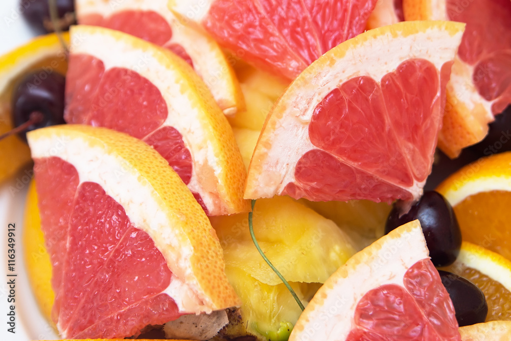 Red background of grapefruit slices Stock Photo | Adobe Stock
