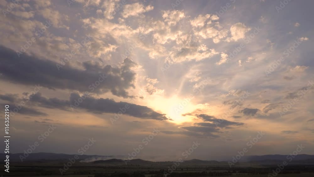 Fire in a Mountain Forest at Sunset. Smoke Rises High Above the Mountain Slopes Fire in a Mountain Forest at Sunset. Smoke Rises High Above the Mountain Slopes