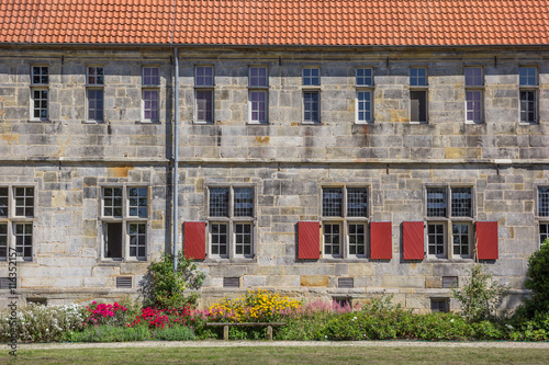 Bench and flowers at the Frenswegen monastery in Nordhorn photo