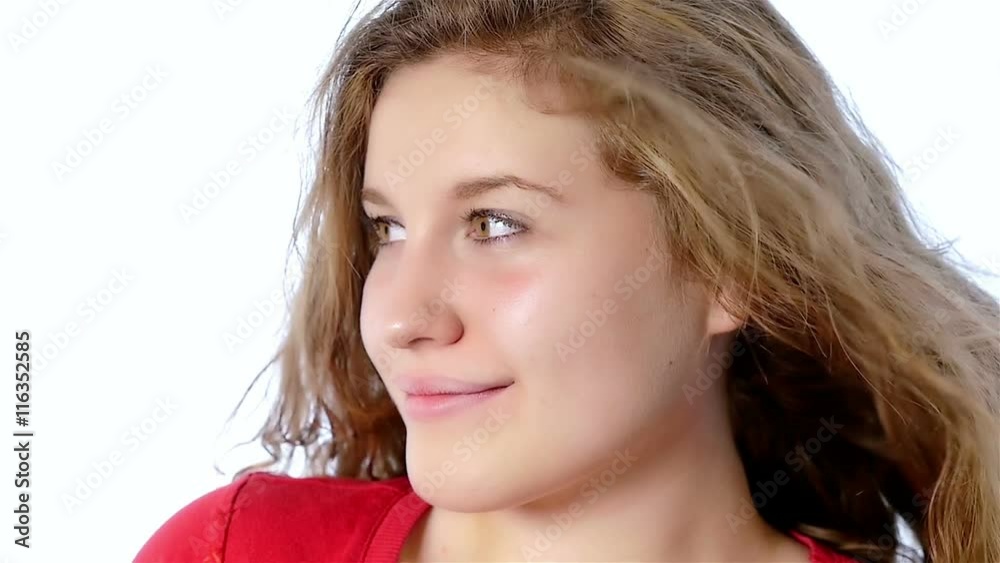 Portrait of a beautiful teenager girl on a white background, slow motion Portrait of a beautiful teenager girl on a white background, slow motion
