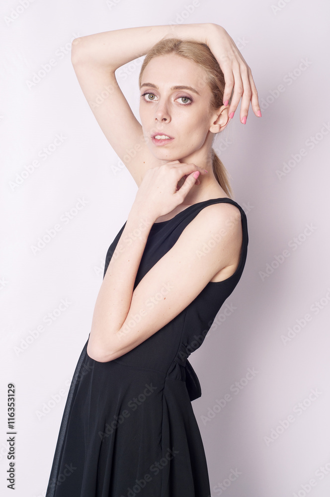Portrait of a sophisticated girl in the black dress Portrait of a sophisticated girl in the black dress