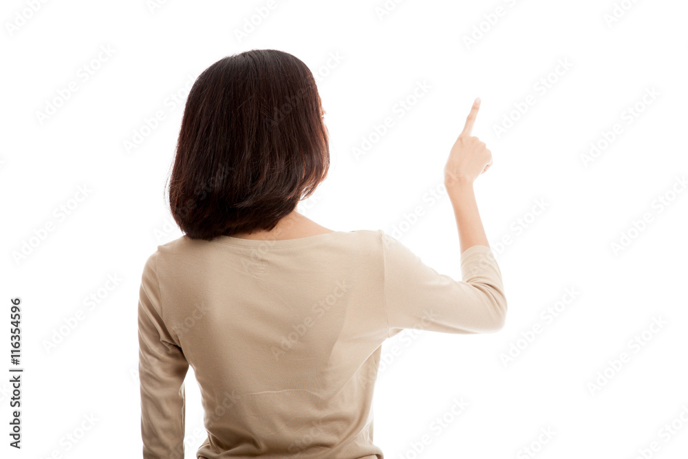 Back of Asian woman touching the screen with her finger isolated on white background Back of Asian woman touching the screen with her finger isolated on white background
