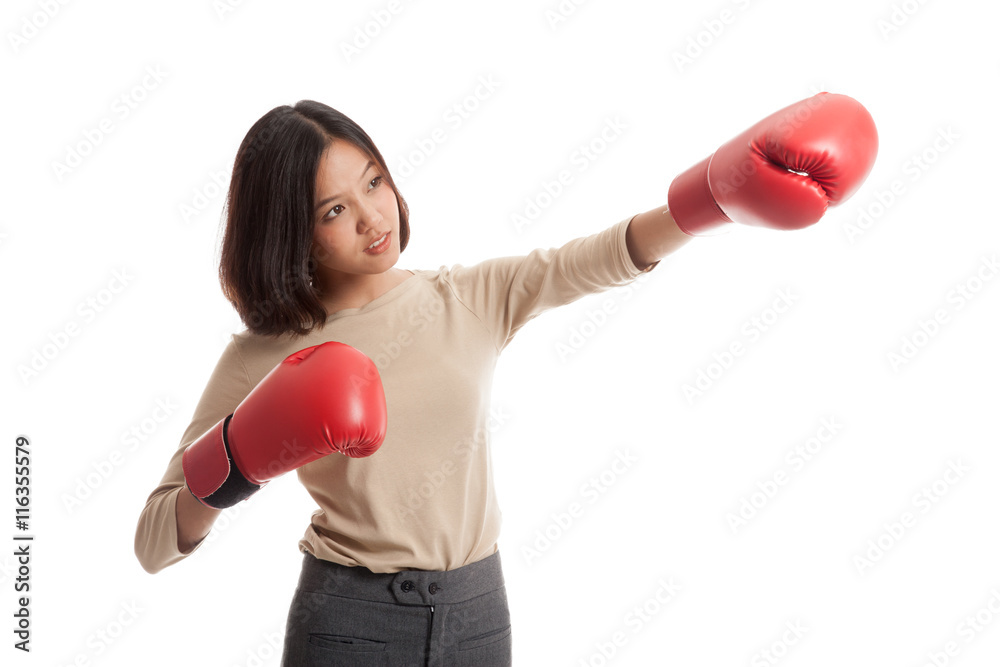 Young Asian business woman with red boxing gloves isolated on white background Young Asian business woman with red boxing gloves isolated on white background