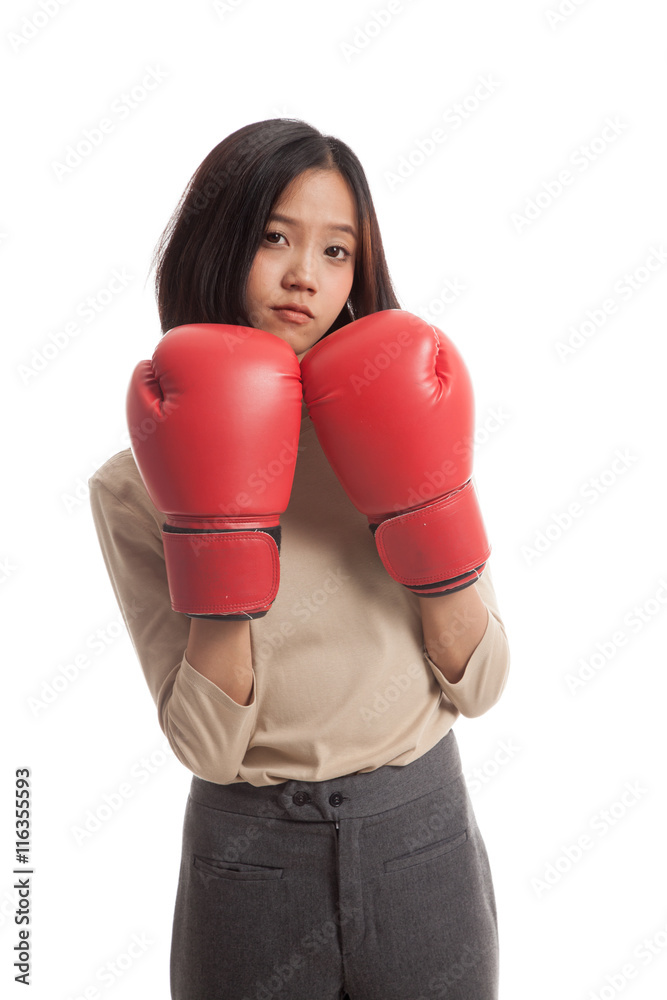 Young Asian business woman with red boxing gloves isolated on white background Young Asian business woman with red boxing gloves isolated on white background