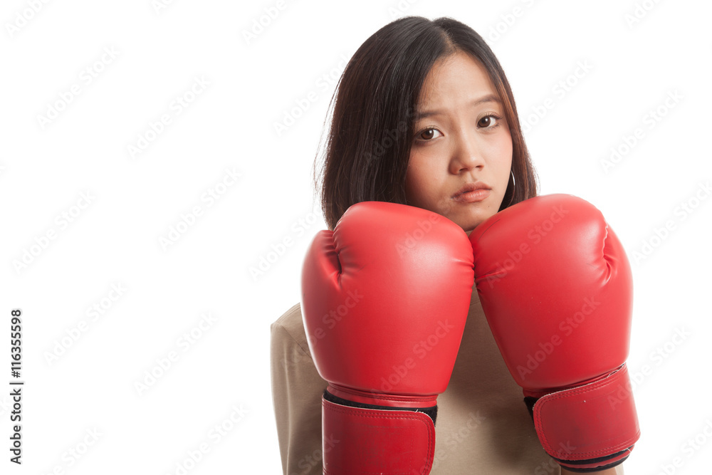 Young Asian business woman with red boxing gloves isolated on white background Young Asian business woman with red boxing gloves isolated on white background