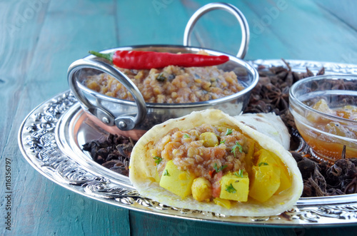 Masala dosa with mint rasam dish photo