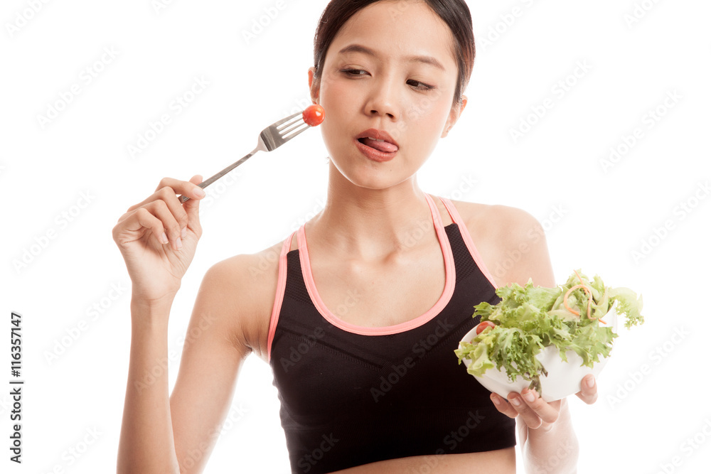 Beautiful Asian healthy girl enjoy eating salad isolated on white background Beautiful Asian healthy girl enjoy eating salad isolated on white background
