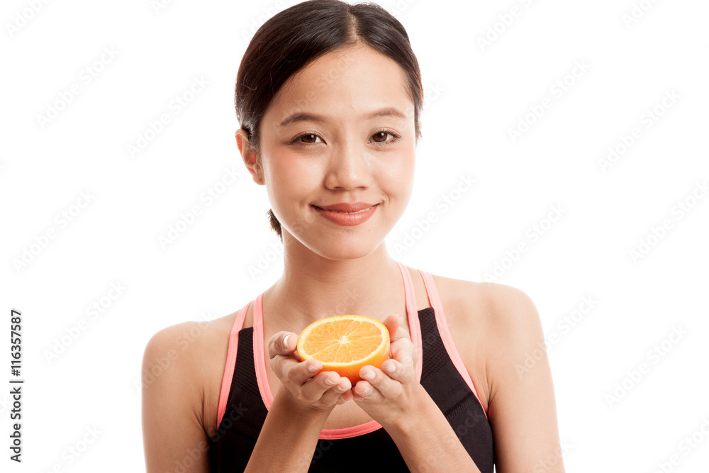 Beautiful Asian healthy girl with orange fruit isolated on white background Beautiful Asian healthy girl with orange fruit isolated on white background