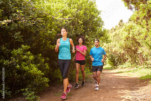 Three joggers running a fun trail