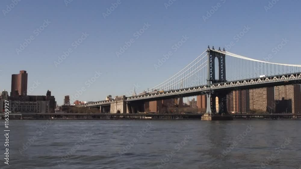 Manhattan bridge, Manhattan skyline and a taxi boat. Manhattan bridge, Manhattan skyline and a taxi boat.