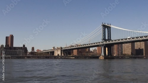 Manhattan bridge, Manhattan skyline and a taxi boat.