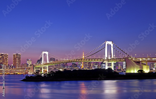 Rainbow bridge, located at Odaiba Tokyo, with Tokyo skyline in background at twilight © lusia83