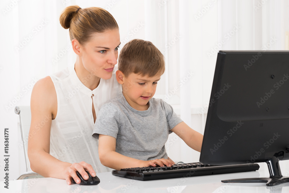 Mother And Son Using Computer Mother And Son Using Computer