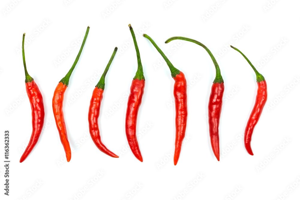 Top view of red chilli peppers on white background