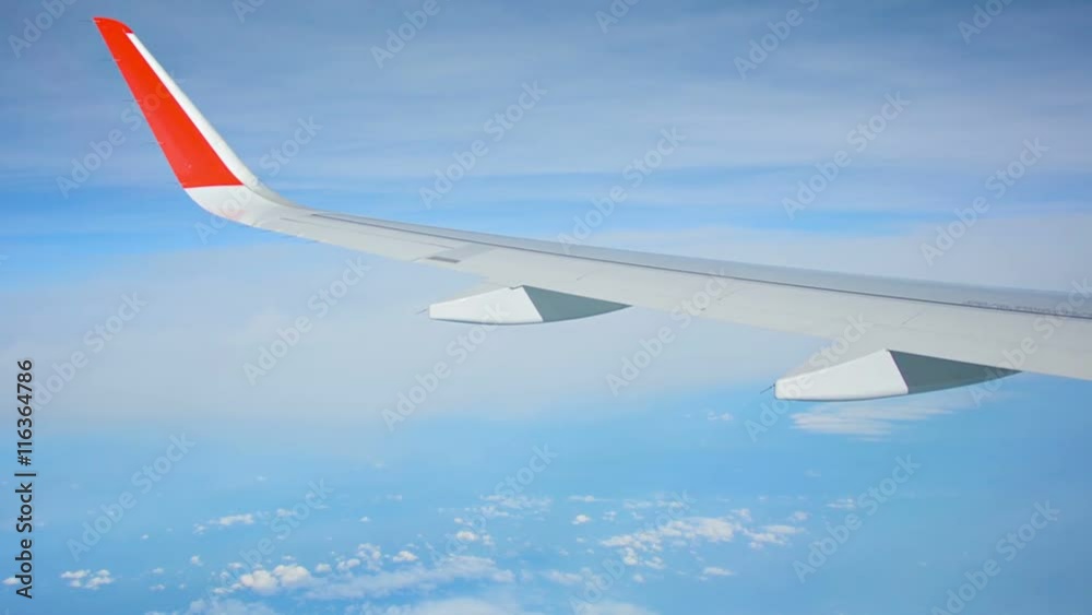Video 1080p - View from the window of the plane. Seen wing and clouds Video 1080p - View from the window of the plane. Seen wing and clouds