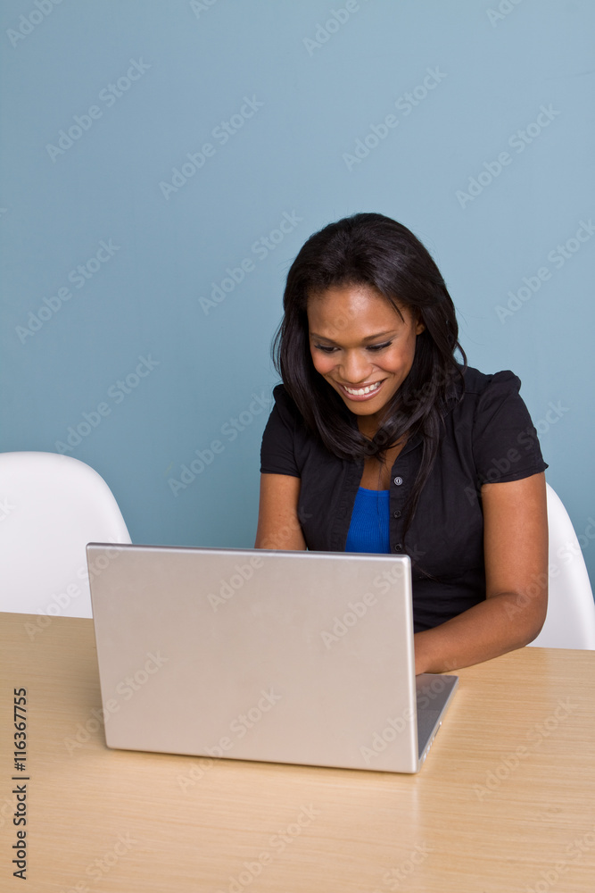 African American woman working on the computer African American woman working on the computer