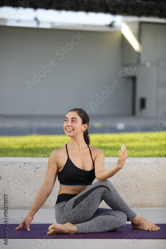 Woman in a yoga fitness pose in the park