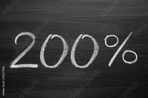 200 percent header written with a chalk on the blackboard
