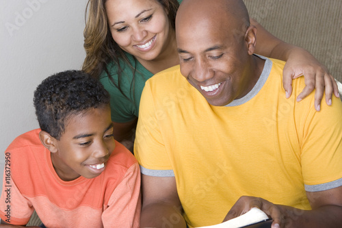 African American Family reading toghter photo