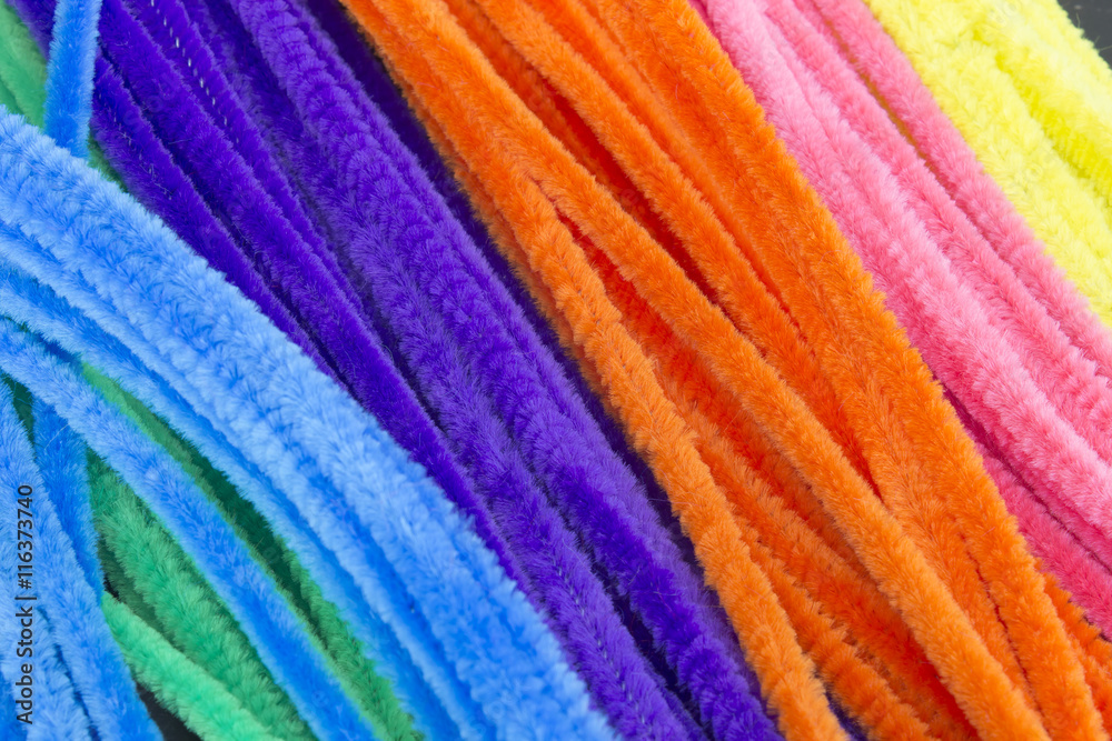 Blue,Green,Purple,Orange,Pink and Yellow Pipe Cleaners Background
