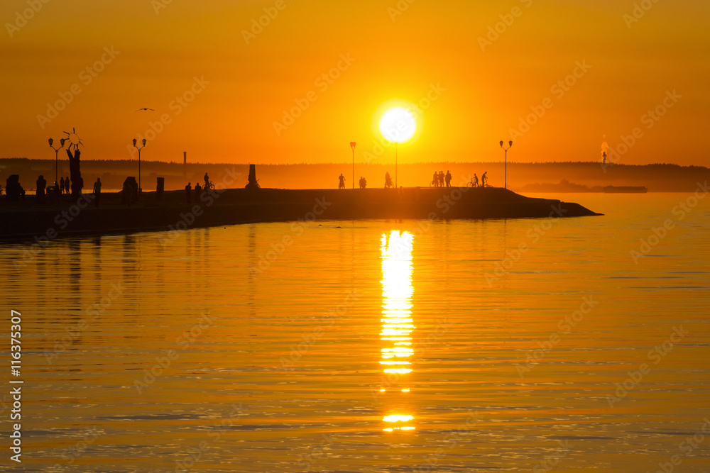 Hot orange sundown on lake