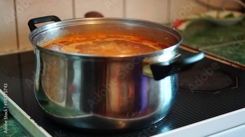 Boiling soup on kitchen stove