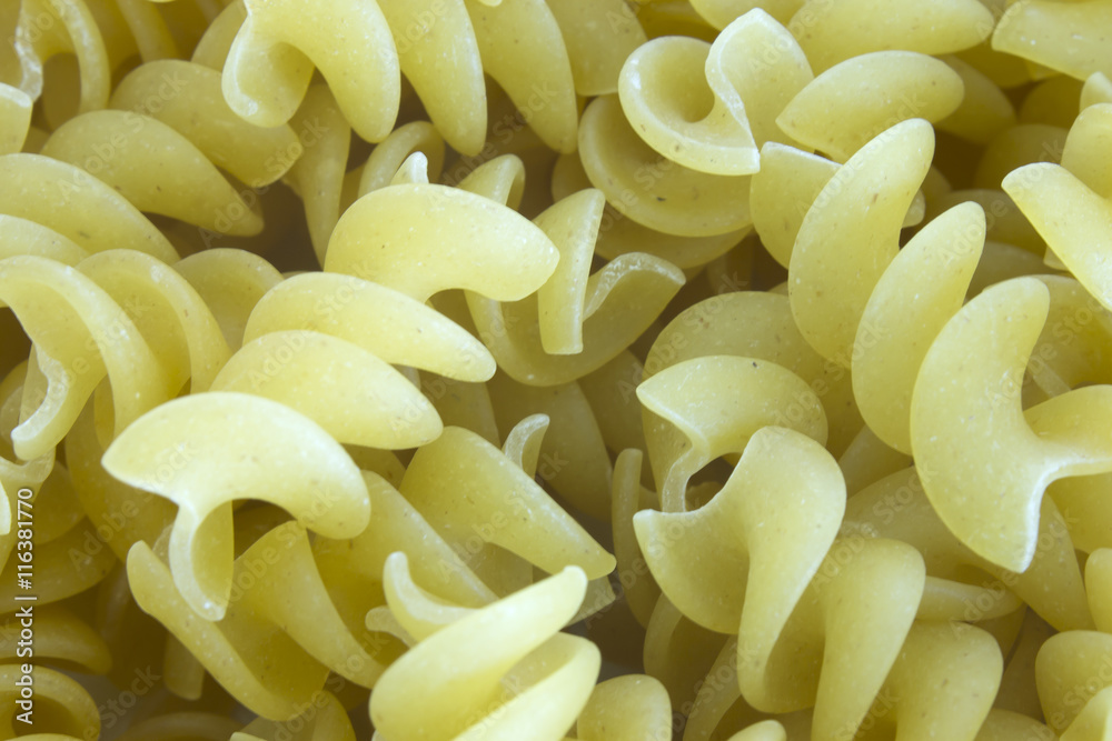 This is a photograph of uncooked Rotini Pasta This is a photograph of uncooked Rotini Pasta