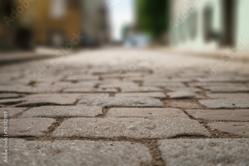 perspective view of old paved road in town