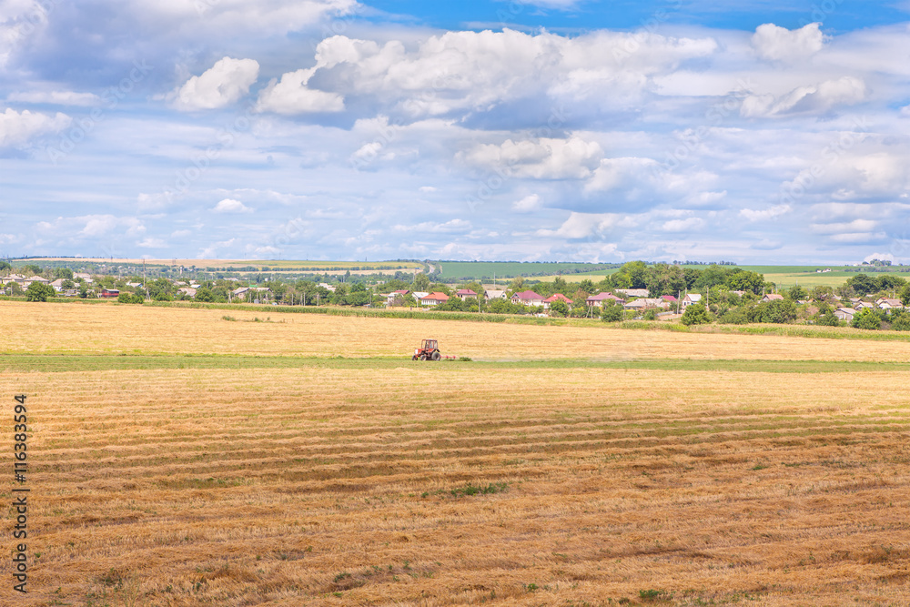 Obraz premium tractor working on field