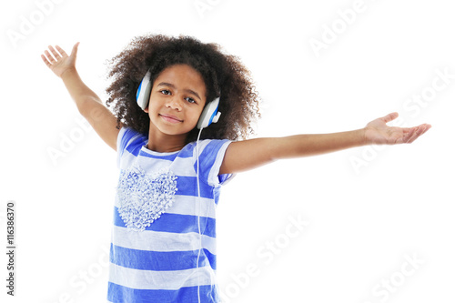 Afro-American little girl with headphones isolated on white