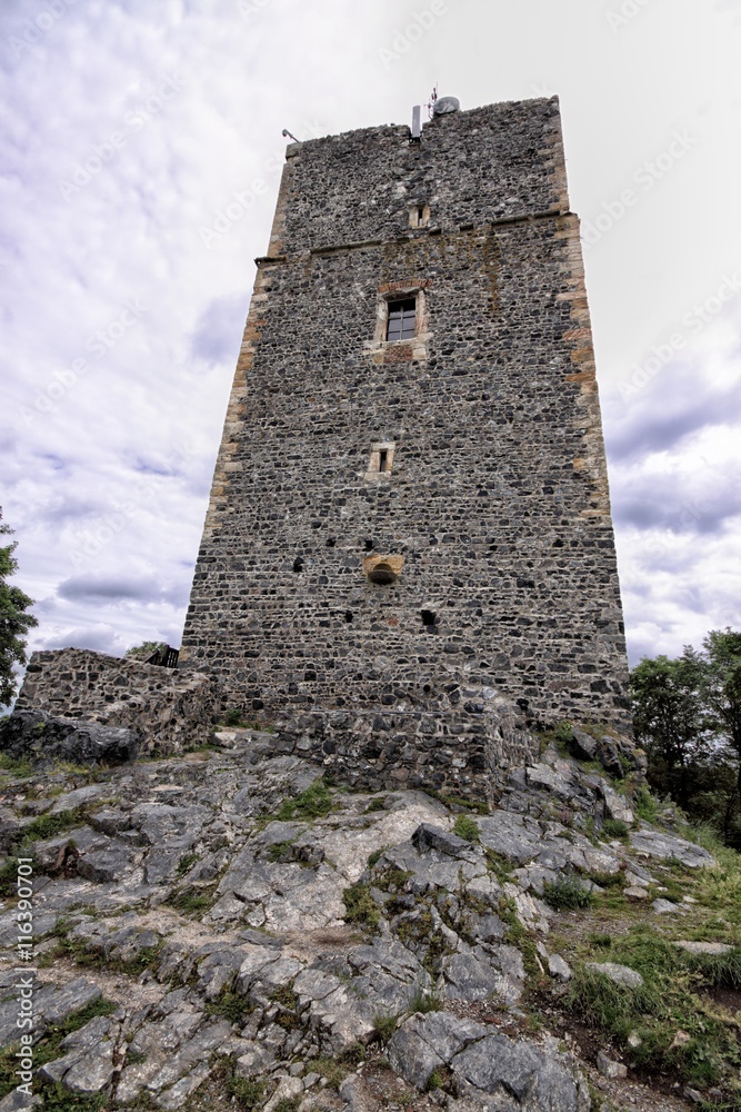 High medieval castle tower on the rocky hill