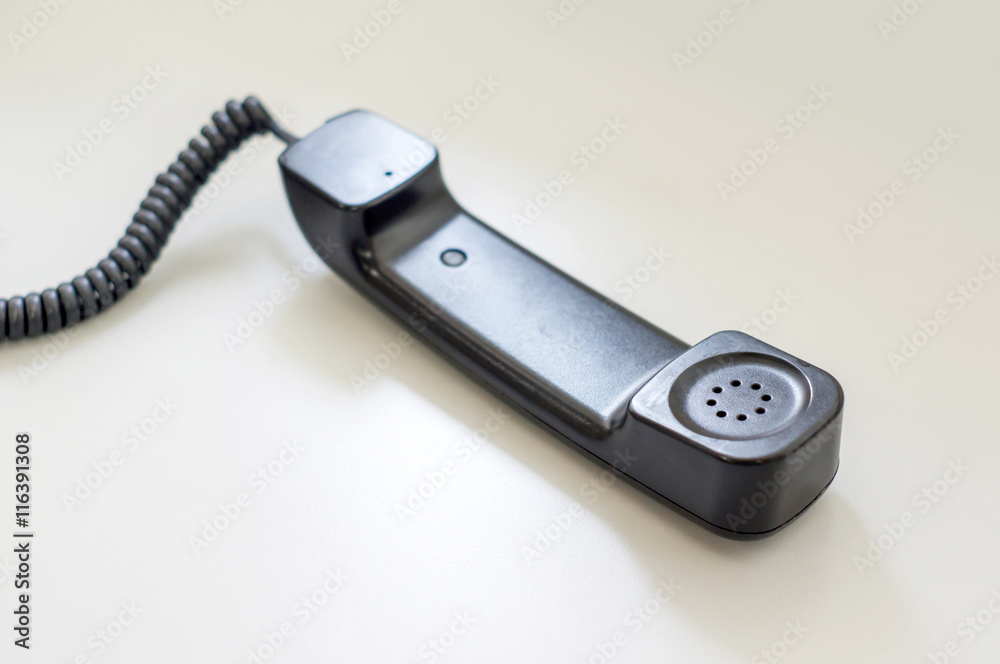 black telephone picking on a desk, soft focus. black telephone picking on a desk, soft focus.