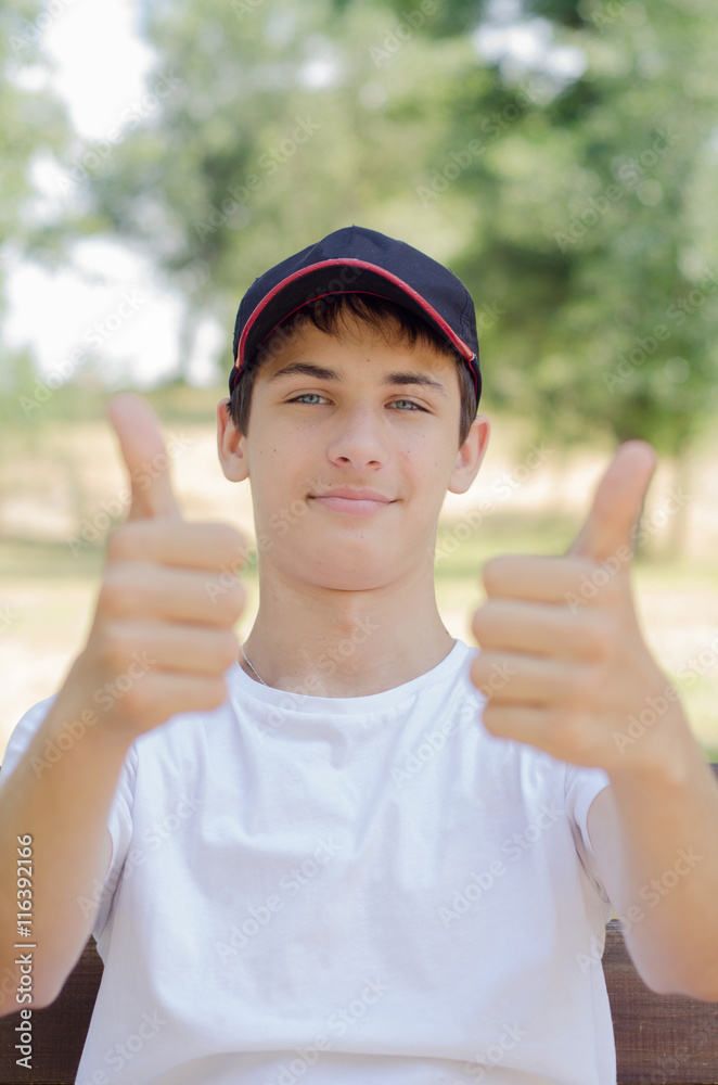 Close up portrait of a cute teenager in a baseball cap. Close up portrait of a cute teenager in a baseball cap.