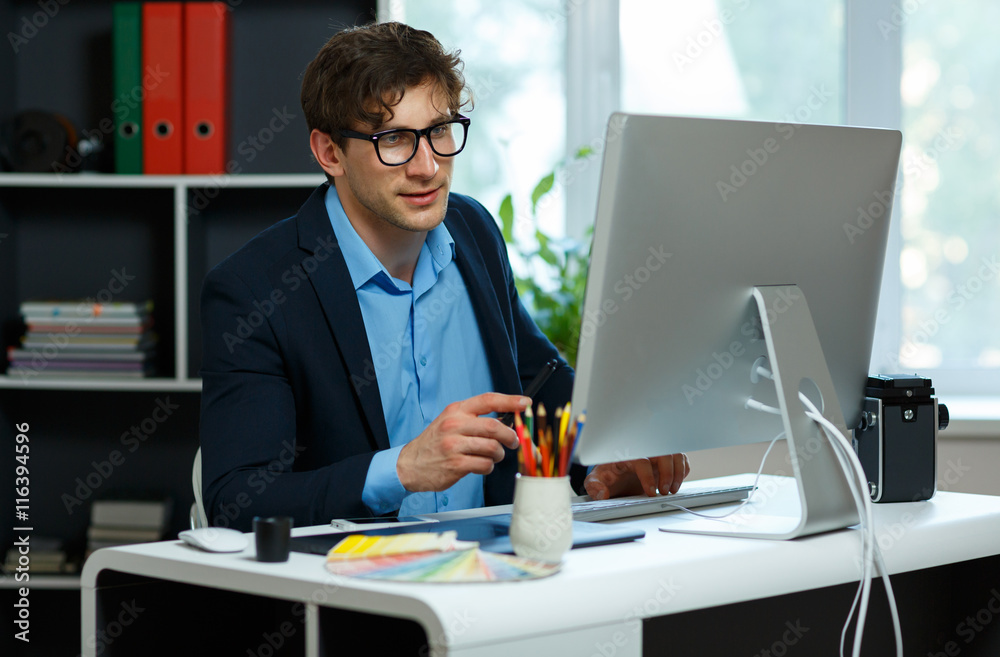 Handsome young man working from home office