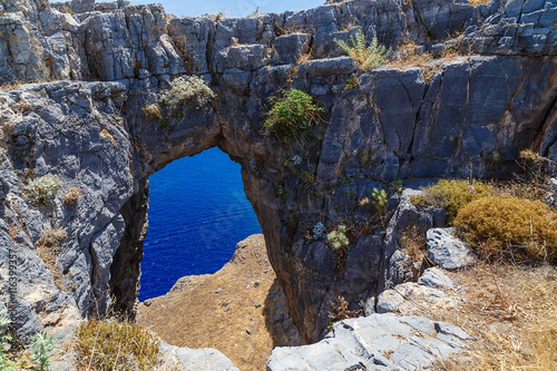 Beautiful natural rock arch near of Ayia Napa, Cavo Greco and Protaras on Cyprus island, Mediterranean Sea. Legendary bridge lovers. Amazing blue green sea and sunny day.
