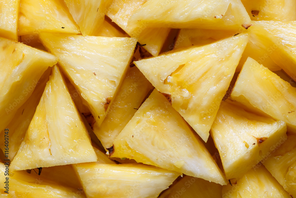 Background of freshly cut pineapple pieces from above. Background of freshly cut pineapple pieces from above.
