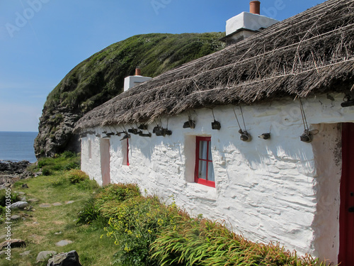 White fisherman's cottage in niarbyl isle of man photo