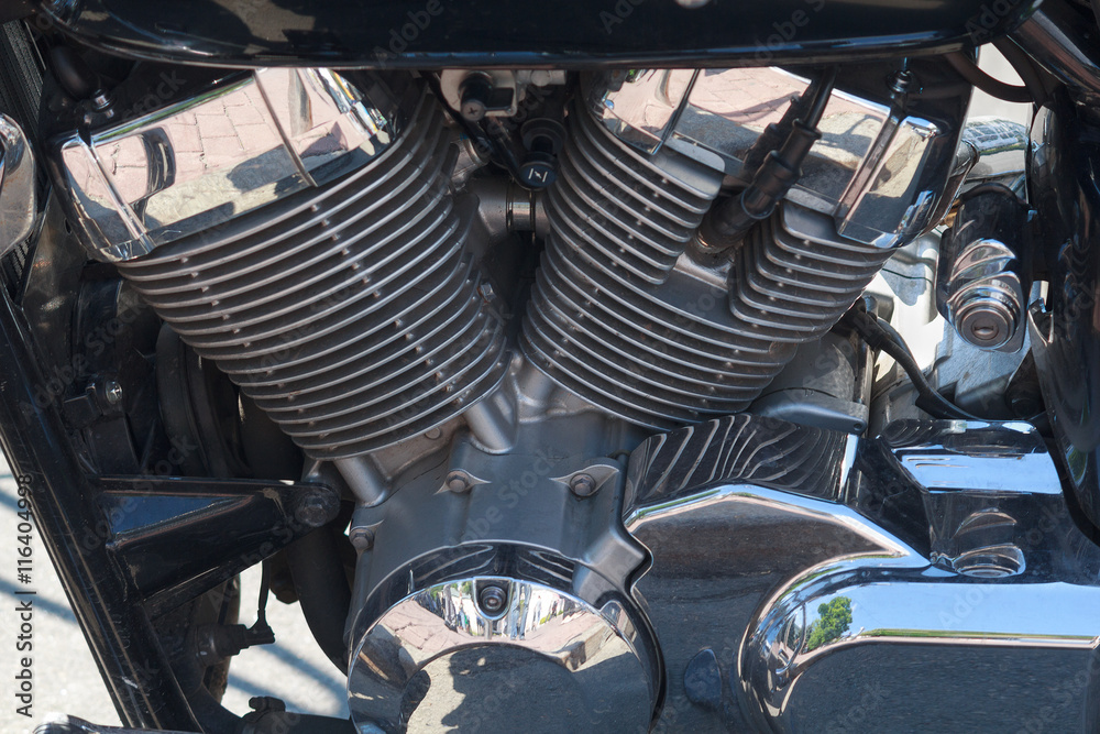 Fototapeta premium Chrome engine motorcycle road close-up. Transport