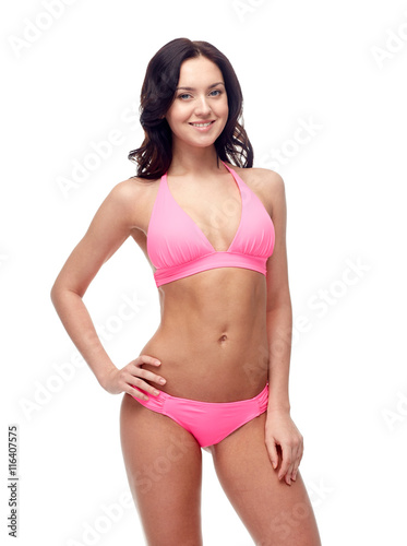 happy young woman in pink bikini swimsuit