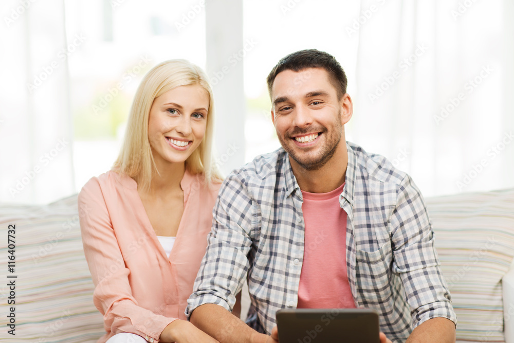 smiling happy couple with tablet pc at home smiling happy couple with tablet pc at home