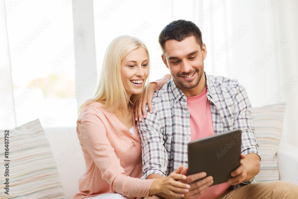 smiling happy couple with tablet pc at home smiling happy couple with tablet pc at home