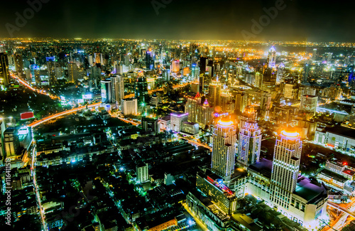 view over the big asian city of Bangkok , Thailand at nighttime when the tall skyscrapers are illuminated © khlongwangchao