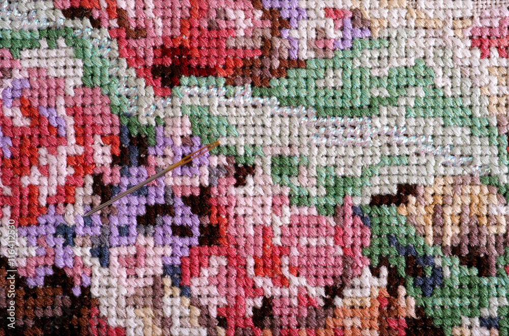 Multicolor cross stitch with needle Multicolor cross stitch with needle