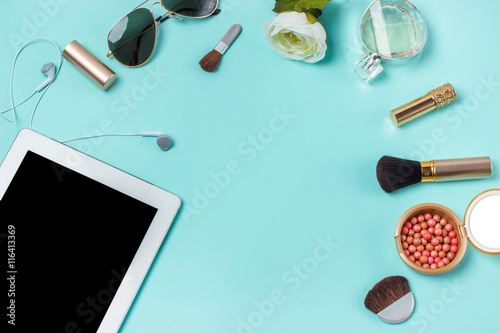 women's clothes on the turquoise background, layout female table