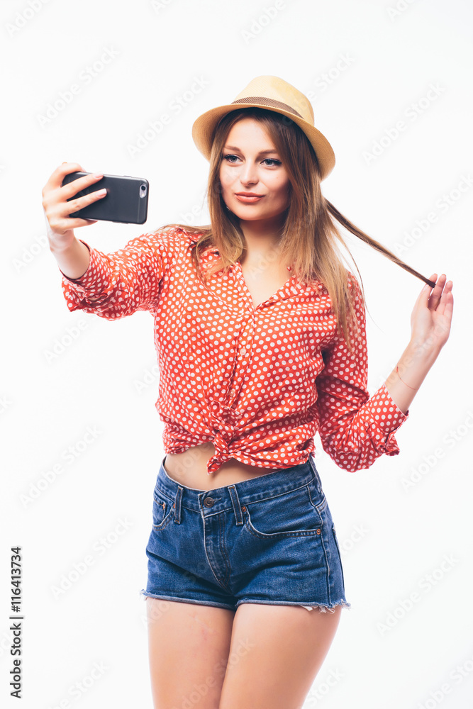 Happy cute woman making selfie over white background. Happy cute woman making selfie over white background.