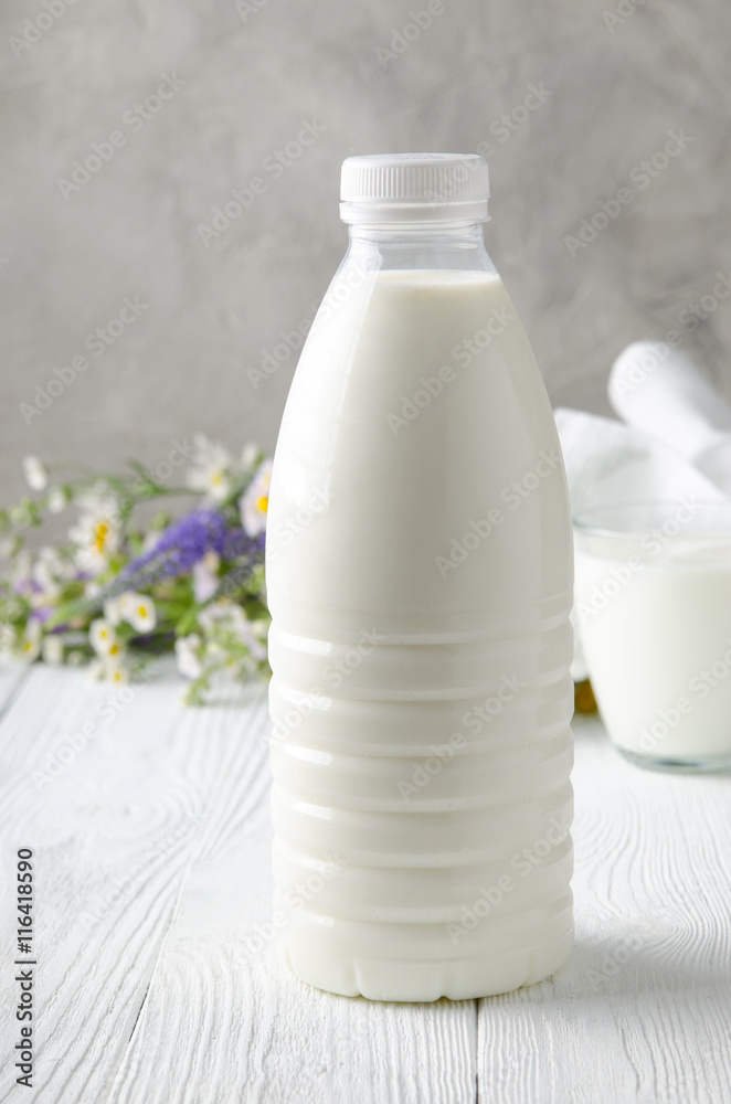 Milk in the bottle. Farm milk in a glass. Package. Milk in the bottle. Farm milk in a glass. Package.