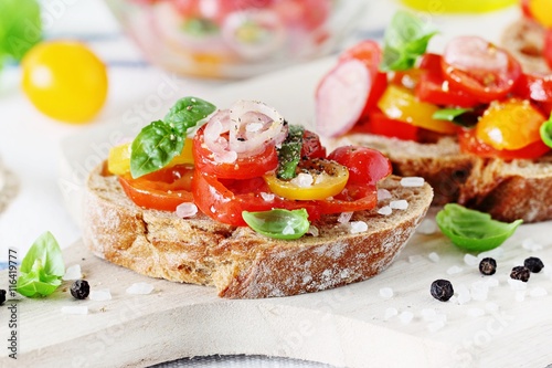 Traditional Italian bruschetta with tomatoes,shallot and basil. Selective focus 